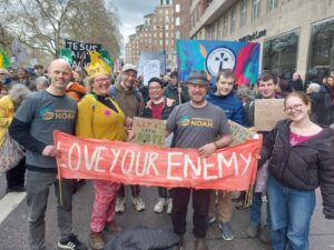 Operation Noah staff and supporters holding banner at the Together Alliance March